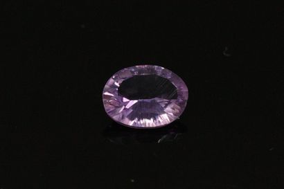null Amethyst oval concave on paper. 

Weight : 2.37 cts.