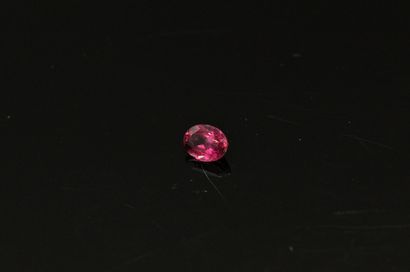 null Pink tourmaline oval on paper. 

Weight : 1.35 cts.