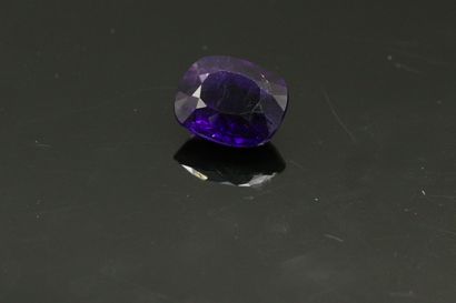 null Amethyst cushion on paper. 

Weight : 18.07 cts.