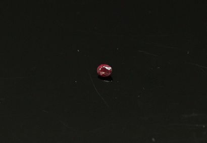 null Oval ruby on paper. 

Weight : 0.26 cts.
