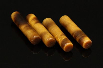 null Double pairing of tiger eye stick size. 

4 pieces

Weight : 18.15 cts.