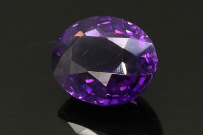 null Oval amethyst on paper. 

Weight : 29.75 carats.