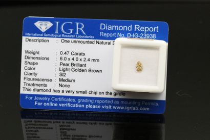 null Light golden brown" pear diamond under seal.

Accompanied by a certificate of...