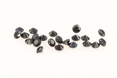 null Mixed round black spinels on paper. 

Total weight : 1.38 ct