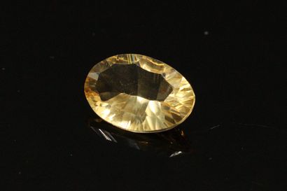 null Oval citrine on paper. 

Weight : 3.98 cts.