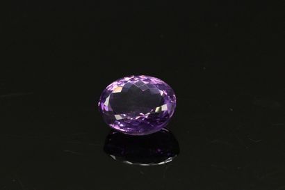 null Oval amethyst on paper.

Weight: 23.83 cts.