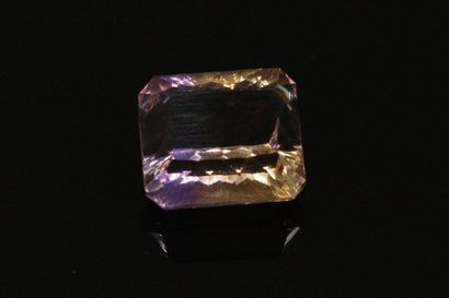null Fancy rectangular ametrine on paper. 

Weight : 7.26 cts.
