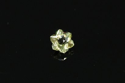 null Yellow quartz flake on paper.

Weight 2.30 cts.