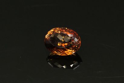 null Oval smoked topaz on paper. 

Weight : 18.40 cts.
