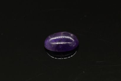 null Amethyst cabochon on paper. 

Weight : approx. 16.90 cts.