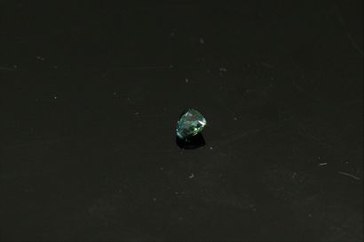null Green-blue sapphire trillion on paper. 

Weight : 0.48 cts.