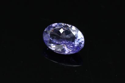 null Oval Tanzanite on paper.

Weight : 1.28 cts.