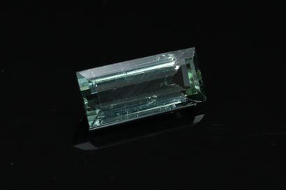 null Tourmaline baguette on paper. 

Weight : 2.83 cts.