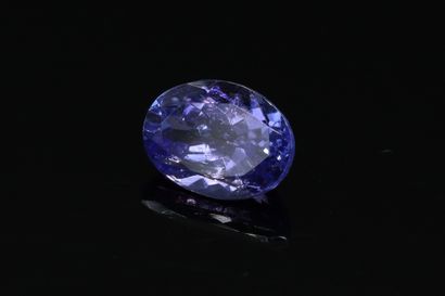 null Oval Tanzanite on paper.

Weight : 1.46 cts.
