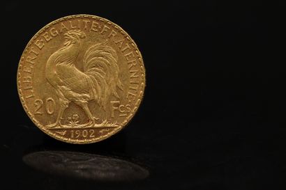 null Gold coin of 20 Francs with rooster (1902)

Weight :6.46 g.