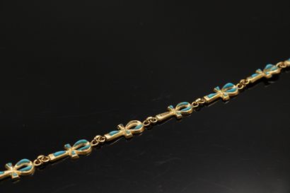 null Bracelet en or jaune 18K (750) formé de croix Ankh émaillée (manques).

Poids...