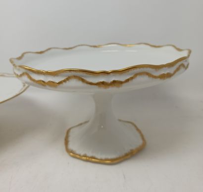 null Fruit bowl and cake stand in white porcelain with curved edge and gilding. A...