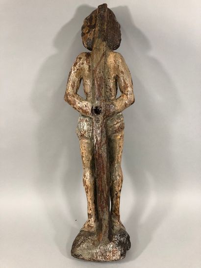 null Saint Sebastian in carved oak with remains of polychromy. The saint is standing...