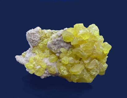 null Native sulfur: aggregate of translucent yellow crystals (up to 15 mm) on 

white...