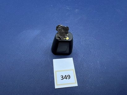 null Small massive dark brown ferrous meteorite (1940) labeled "Bretagne". 

Size...