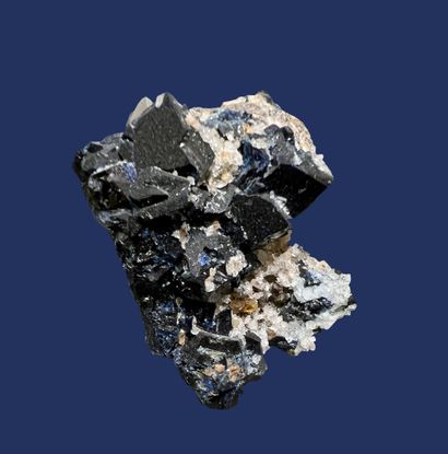 null Lazulite: aggregate of iridescent dark blue crystals up to 15 mm. Difficult...