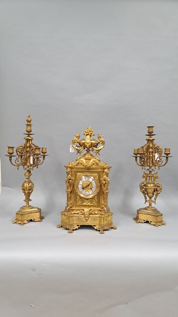 Chased and gilded bronze mantel set consisting...