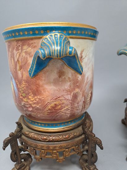 null Pair of porcelain flowerpots with polychrome and gold decoration, decorated...