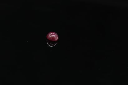 null Round ruby cabochon on paper. 

Weight : 2.15 cts. 



Diameter : 7 mm