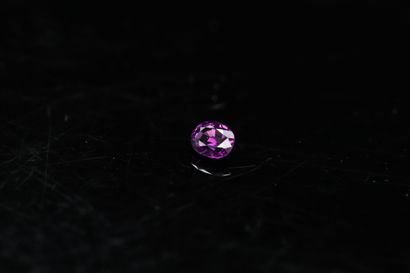Oval saturated violet garnet on paper. 

Weight...