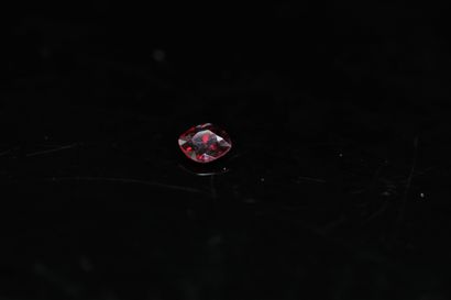 Cushion red spinel on paper. 

Weight : 0.54...