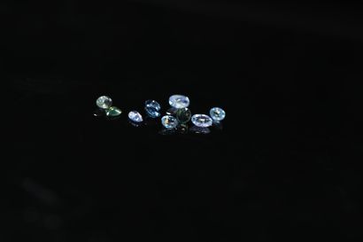 null Lot of ten sapphires of various sizes including pear, oval, round, on paper

Some...
