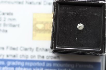 null Round "off-white" diamond under seal.



Accompanied by a certificate of the...