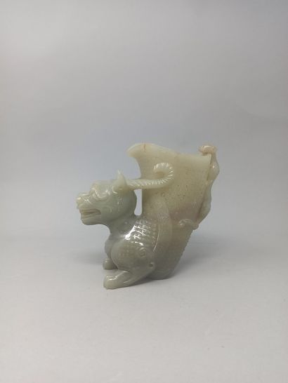 null Hard stone bowl stylizing a dragon with a chimera on its back.

Modern China

H....