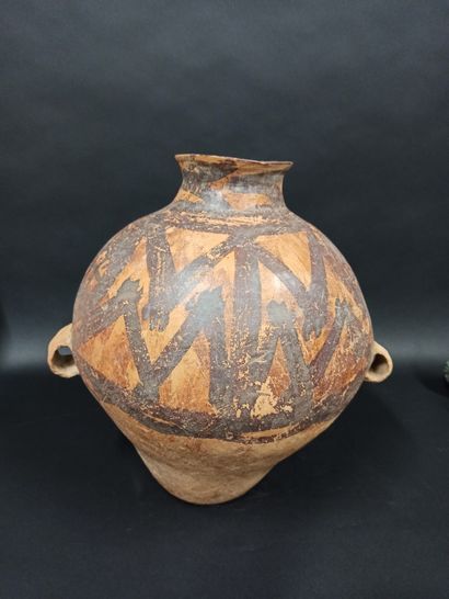 null Earthenware jar with two handles and polychrome slip.

China, Neolithic style

H....