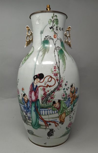 null CHINA, 20th century

Porcelain vase decorated on one side with calligraphy and...