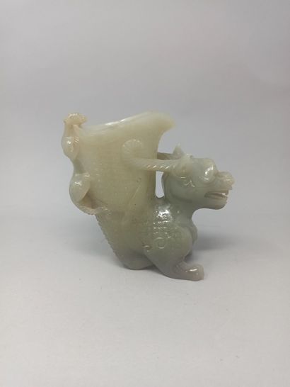 null Hard stone bowl stylizing a dragon with a chimera on its back.

Modern China

H....