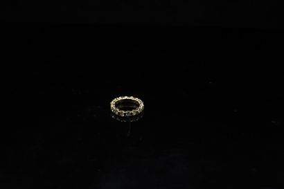 null American wedding band in 18K (750) yellow gold, set with round diamonds and...