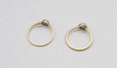 null Lot of two 18k (750) yellow gold and platinum solitaires set with old-cut diamonds....