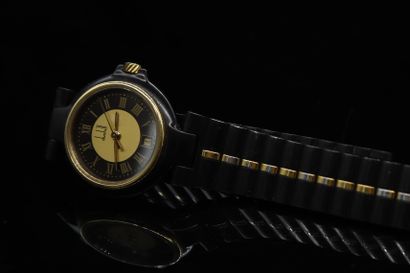 null DUNBILL

Lady's watch in steel and gilt metal, dial with black and gilt background,...