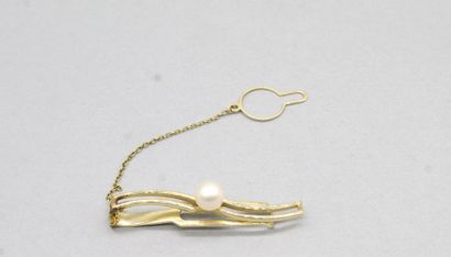 null Tie pin in 14k (585) yellow gold with a cultured pearl. 

Length : 4.6 cm. -...