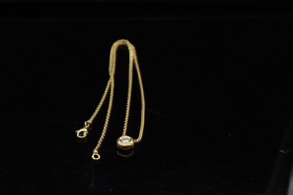 null 18k (750) yellow gold chain and its pendant in 18k yellow gold with a diamond...