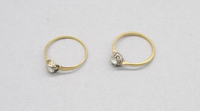 null Lot of two 18k (750) yellow gold and platinum solitaires set with old-cut diamonds....