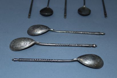 null 
A small silver spoon. Minerve mark.

Eight small spoons with Russian handles,...