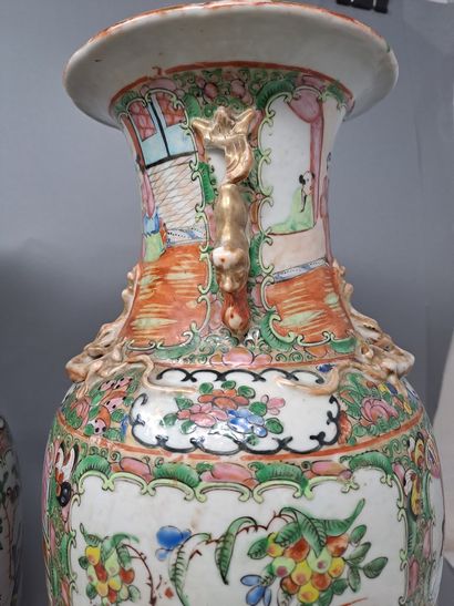 null Two polychrome porcelain vases decorated with characters, flowers and birds...
