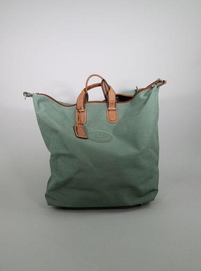 null LANCEL 



Important travel bag made of green canvas and tobacco striped leather....