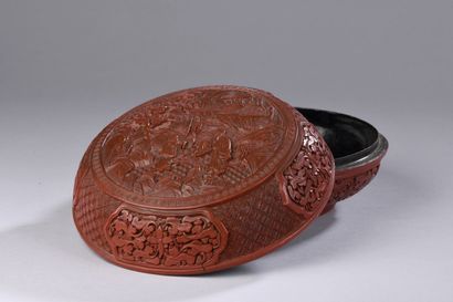 null CHINA - 19th century

Box of lenticular shape in red lacquer carved with a scholar...