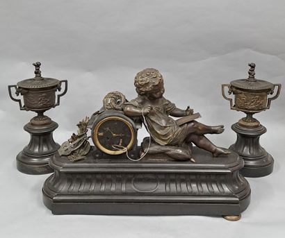 null Black marble and bronze mantel set with a brown patina, consisting of a clock...