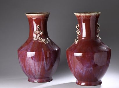 null CHINA - 20th century

Pair of flared-necked baluster vases in flamed red enameled...