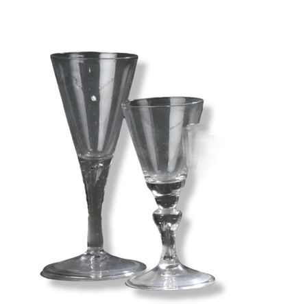 null Set of two glasses with a flared cup, one with a full stem and the other with...