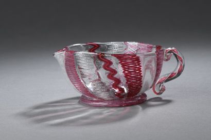 Glass cup with handle and spout with twisted...